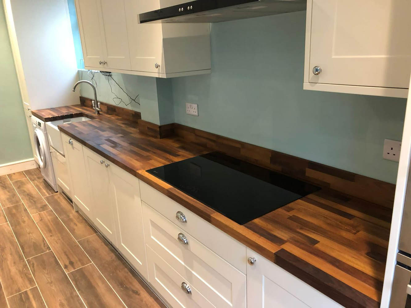 white kitchen with wood effect counter