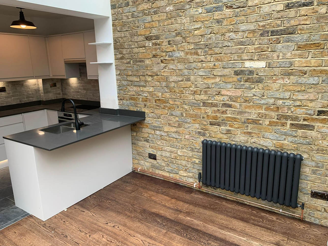 exposed brick wall in a kitchen