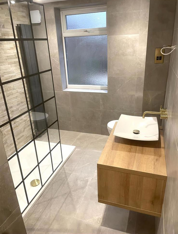 Modern stone effect tiled bathroom