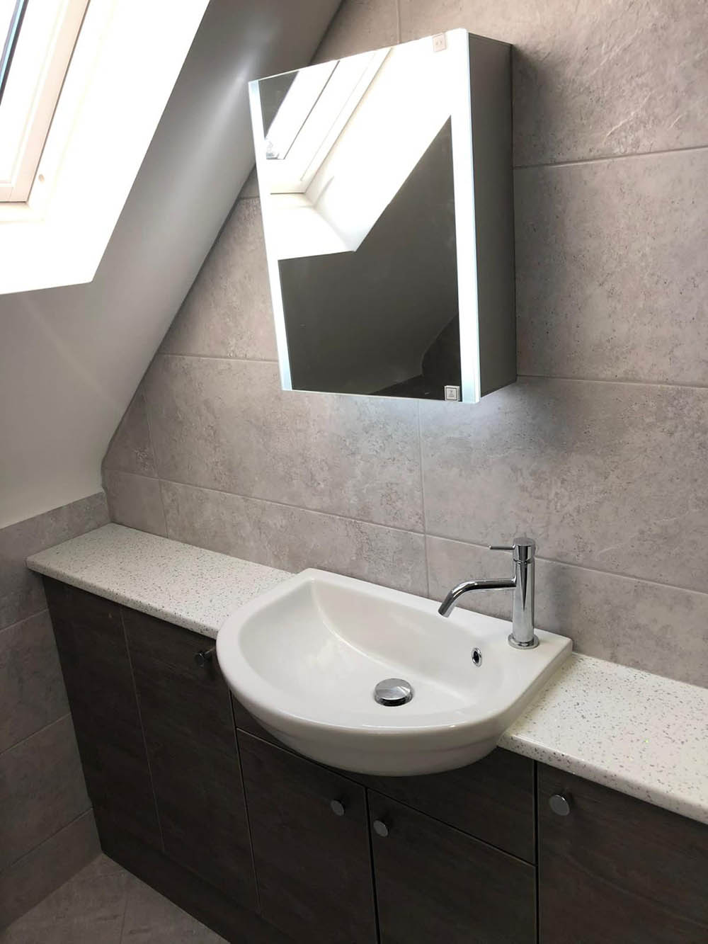 LED mirror with storage over a bathroom sink